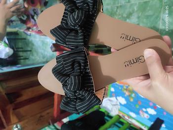 Product Review of [JING] NEW korean fashion flat bowknot gimi sandals shoes for women .（add 1size) from T**. 1