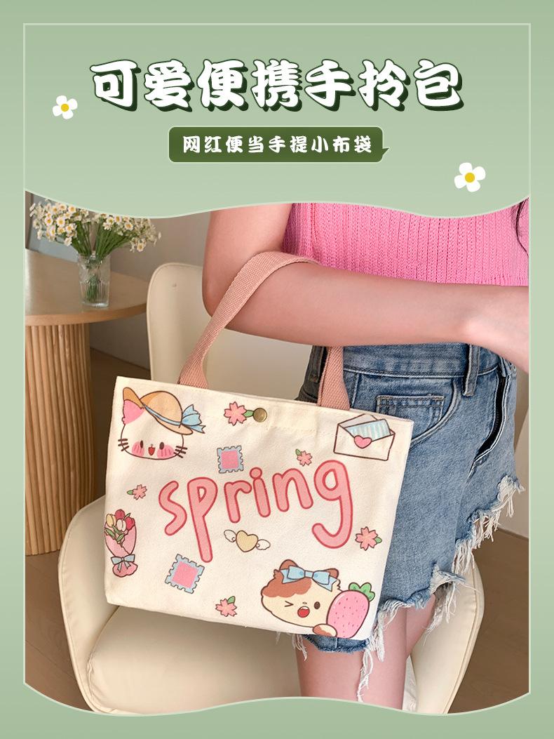 Product Introduction of Túi Vải Bố, Dành Cho Nữ, Thiết Kế Hoạt Hình Chính Hãng Túi Tote Mini, Thích Hợp Cho Nhân Viên Văn Phòng, Túi Xách Nhỏ Túi Đựng Hộp Cơm Trưa, Hàng Mới Về 2025, Bán Buôn Có Sẵn 0