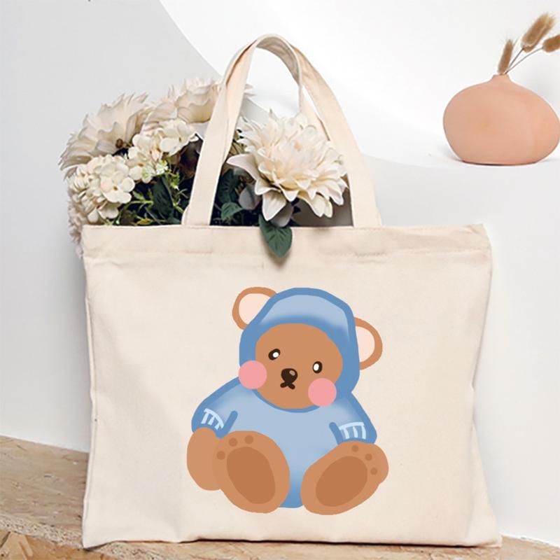 Product Introduction of Cute Cartoon Teddy Bear Printed Canvas Horizontal Handbag Fashionable Versatile One Shoulder Storage Bag 40