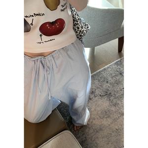 Women's blue striped trousers, loose fit, slim fit, casual style, high waisted pants for walking.