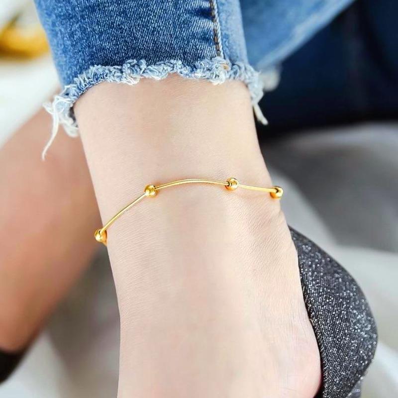  Lắc chân bi mì dành cho nữ chất liệu titan không đen không hoen không gỉ tiếp xúc nước thoải mái bền màu 1-2 năm. Mạ vàng 18k dạng bi mì tròn trơn phong cách thời trang nhẹ nhàng thanh lịch dành cho nữ giới women trang sức. Cao Su 