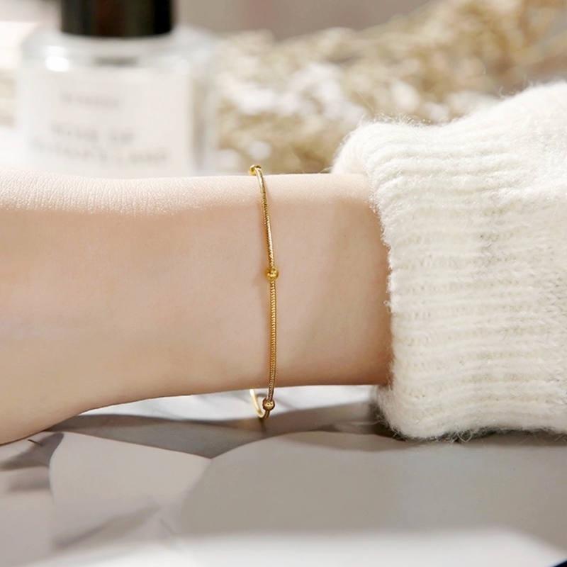 Lắc tay chân bi mì dành cho nữ chất liệu titan không đen không hoen không gỉ tiếp xúc nước thoải mái bền màu 1-2 năm. Mạ vàng 18k dạng bi mì tròn trơn phong cách thời trang nhẹ nhàng thanh lịch dành cho nữ giới women trang sức. Phụ Kiện Chain