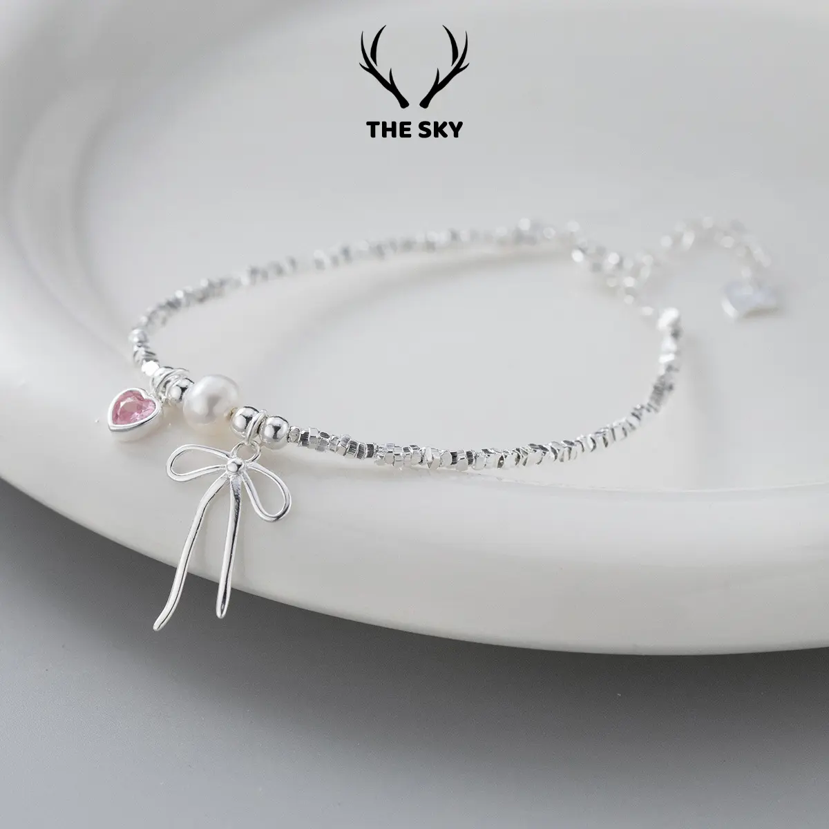 Lắc tay nữ The Sky, vòng tay chuỗi hạt charm tim đá hồng nơ xinh ngọc trai nhân tạo hot trend phụ kiện trang sức đẹp TSLT0.27