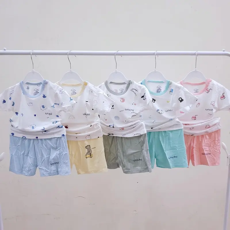 Unchi Bộ quần áo cộc tay mùa hè trẻ em cổ tròn chui đầu cúc vai in họa tiết vải thun lạnh mềm mát cho bé 6-13kg 7