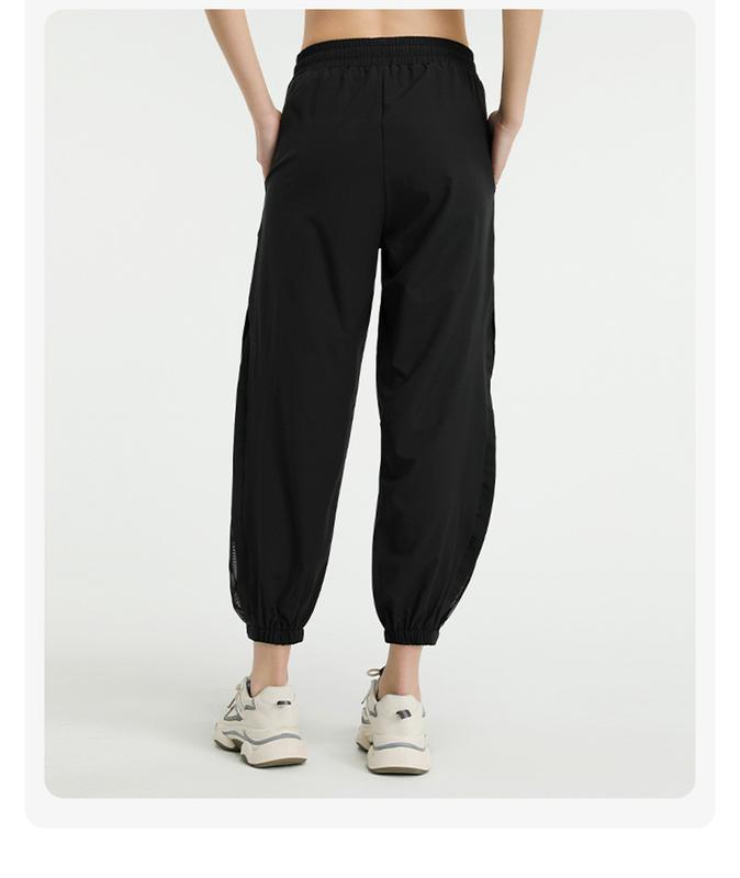 Product Introduction of Loose high-waisted quick-drying pants European and American mesh quick-drying yoga trousers running sports tied feet large-size fitness pants women 18