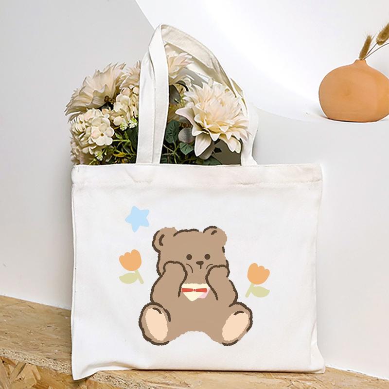 Product Introduction of Cute Cartoon Teddy Bear Printed Canvas Horizontal Handbag Fashionable Versatile One Shoulder Storage Bag 36