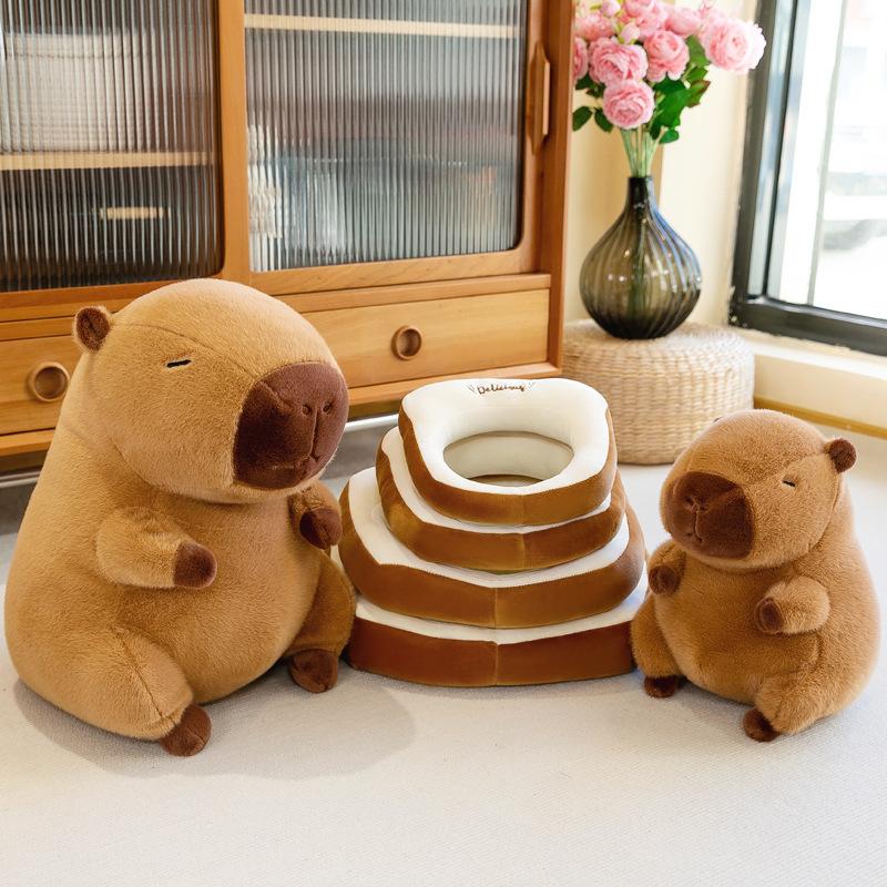 Thú Nhồi Bông Hình Chuột Capybara Đeo Bánh Mì ở cổ, gấu bông chuột lang nước capybara đeo bánh mì nhiều kích thước Thú Bông Toy Đồ Chơi Phát Nhạc