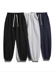 メンズソリッドカラーのドローストリングウエストスウェットパンツ、カジュアルで快適なルーズフィットポケットジョガーパンツを毎日着用し、すべての季節のメンズパンツ