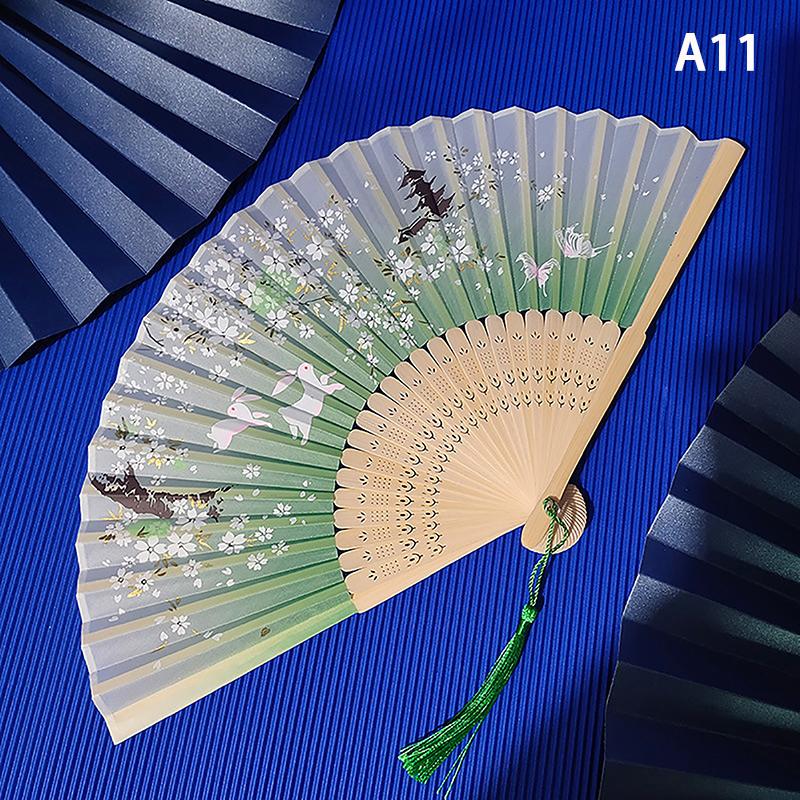 Product Introduction of พัดลมพับ สไตล์จีนโบราณ พัดลมมือไม้ไผ่ ก้านไม้ พัดลมเต้นรำคลาสสิก มีพู่ สง่างาม เหมาะสำหรับผู้หญิง ของตกแต่งบ้าน 35