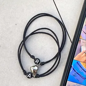gelang couple magnet love warna silver (dapat 2 gelang) bisa req huruf A-Z  Bracelets