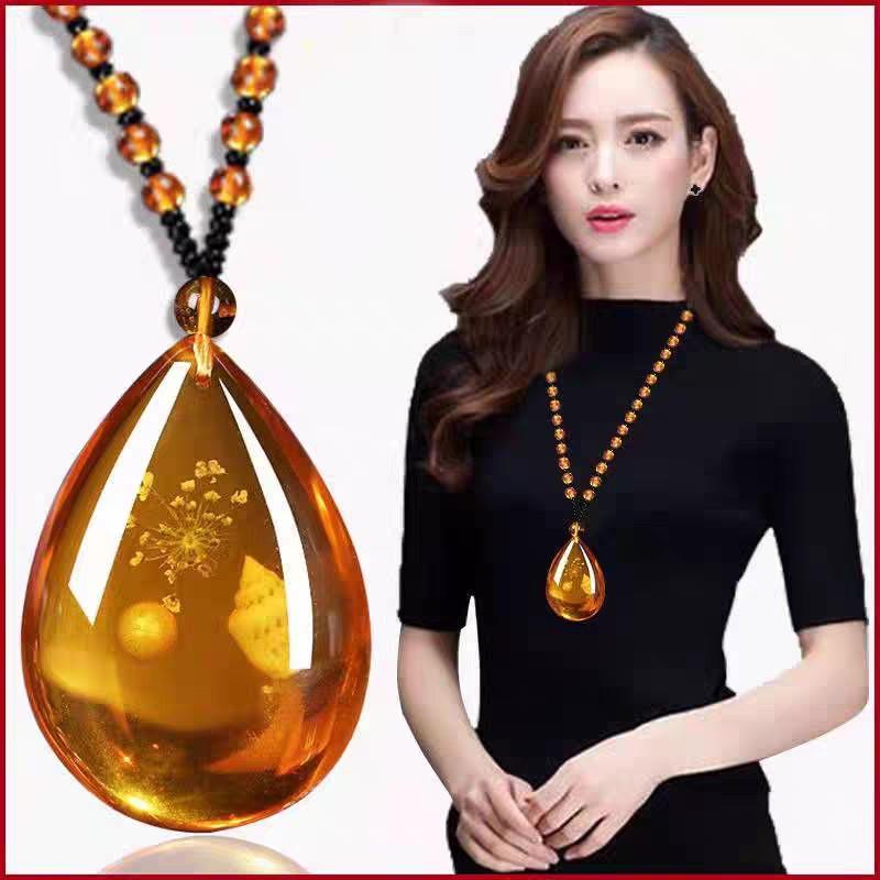 Dây chuyền giả hổ phách ( có ốc và bông hoa ở trong) Trang Sức