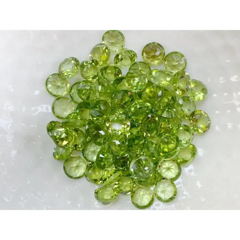 จัดส่งที่รวดเร็ว 6.0mm. พลอยเพอริดอทกลมเจียรเหลี่ยม ราคาเม็ดละ 100฿