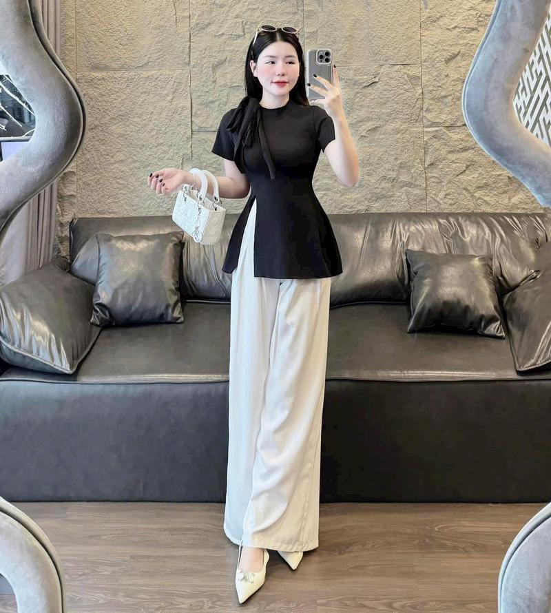 Product Introduction of Set đồ nữ áo tay ngắn cổ tròn buộc nơ xẻ tà mix quần xuông ống rộng dánh dài xinh xắn dành cho các nàng diện đi chơi đi tiệc. Nhung Ong Women Voi 14