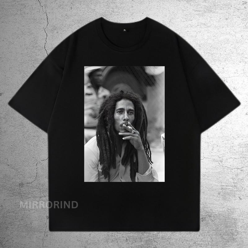 KAOS DISTRO PRIA WANITA MOTIF BAND MUSIK BOB MARLEY LENGAN PENDEK SEMI KATUN 24s PREMIUM QUALITY Hitam Nyaman 0