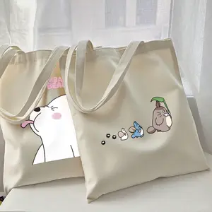 Cute Cartoon Totoro Printed Large-Capacity Canvas Bag, Suitable for Students To Carry School Bags, Office Workers To Commute, Picnics, As Well As Daily Shopping and Home Use, Meeting Various Carrying Needs.