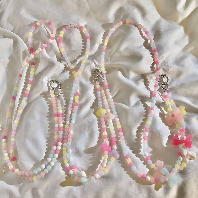 Bao xách chéo dài dây xích thắt lưng nơ hoa màu hồng nữ tính trên Instagram dùng chung cho khóa và camera