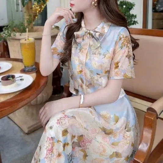 SÉT ÁO NƠ CỔ CÀI NÚT ẨN KÈM CHÂN VÁY XOÈ( CÓ LÓT) Chất Liệu: LỤA Ý IN 3D 2