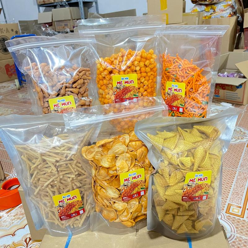  Combo ăn vặt Mẹ Mun 3Kg: Đùi Gà Phô Mai - Nui - Bim Tăm Que - Snack Hình Nón - Quẩy Tai Heo - Bim Khoai Ngó Sen - Tặng 1 Túi Oishi 
