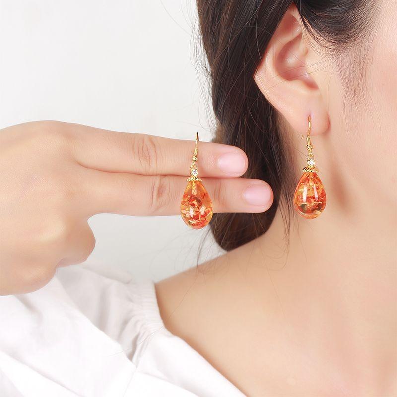 Product Introduction of Natural amber floral earrings, fashionable and versatile women's earrings, ethnic style earrings, pure silver ancient gold ear hooks 5