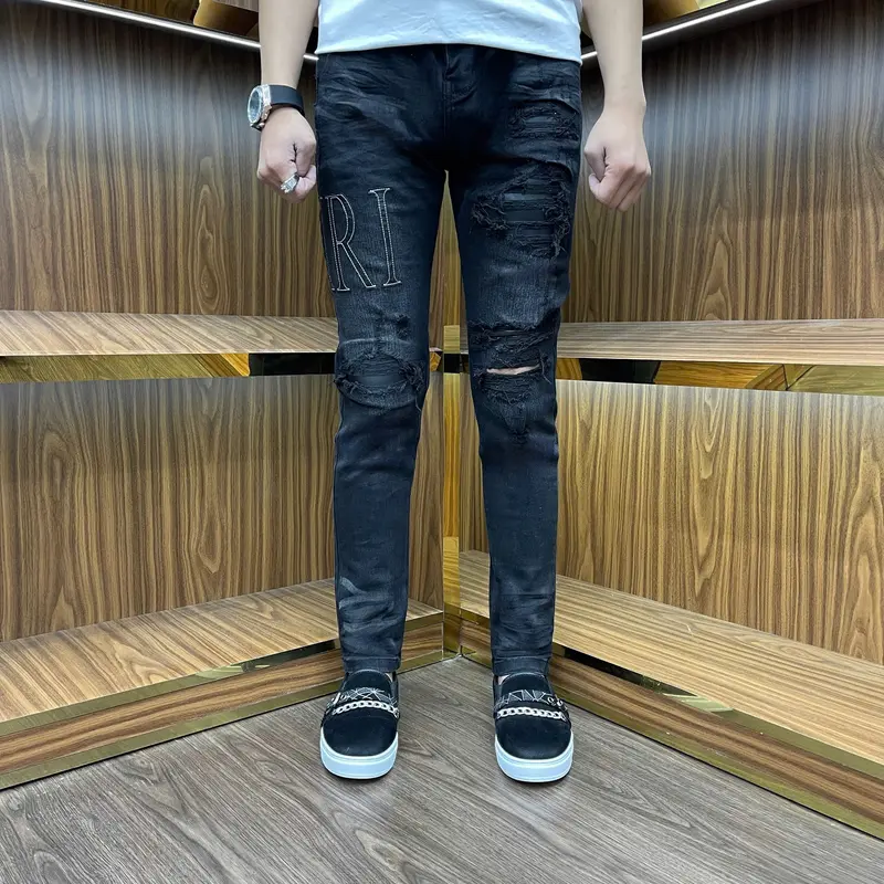 quần Jeans nam  AMR chữ đen túi da sau mông bốn cúc 0