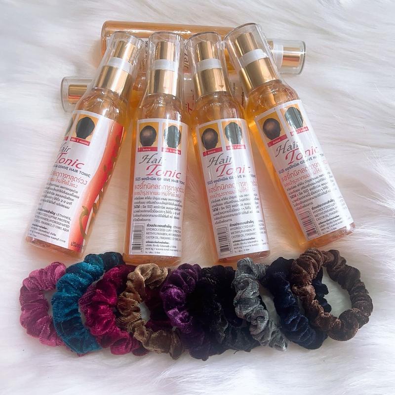 2 chai xịt kèm 1 cột tóc hỗ trợ giúp cho tóc mọc nhiều hơn Women