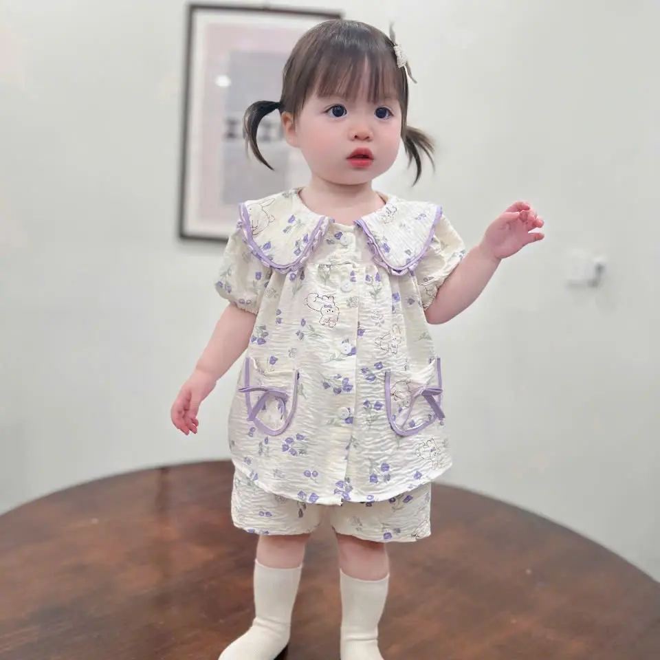 Bộ quần áo pijama cộc mùa hè cho bé , thiết kế cổ sen phối túi nơ xinh yêu , bo viền nổi bật . Chất liệu mềm mát