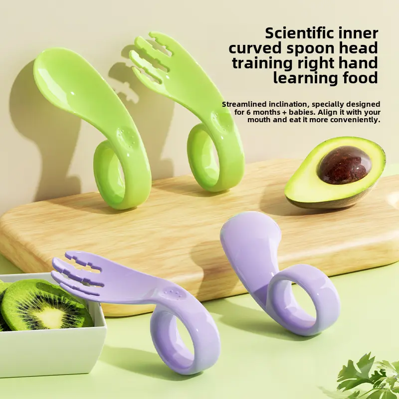 Baby learns to eat independently with fork and spoon training set