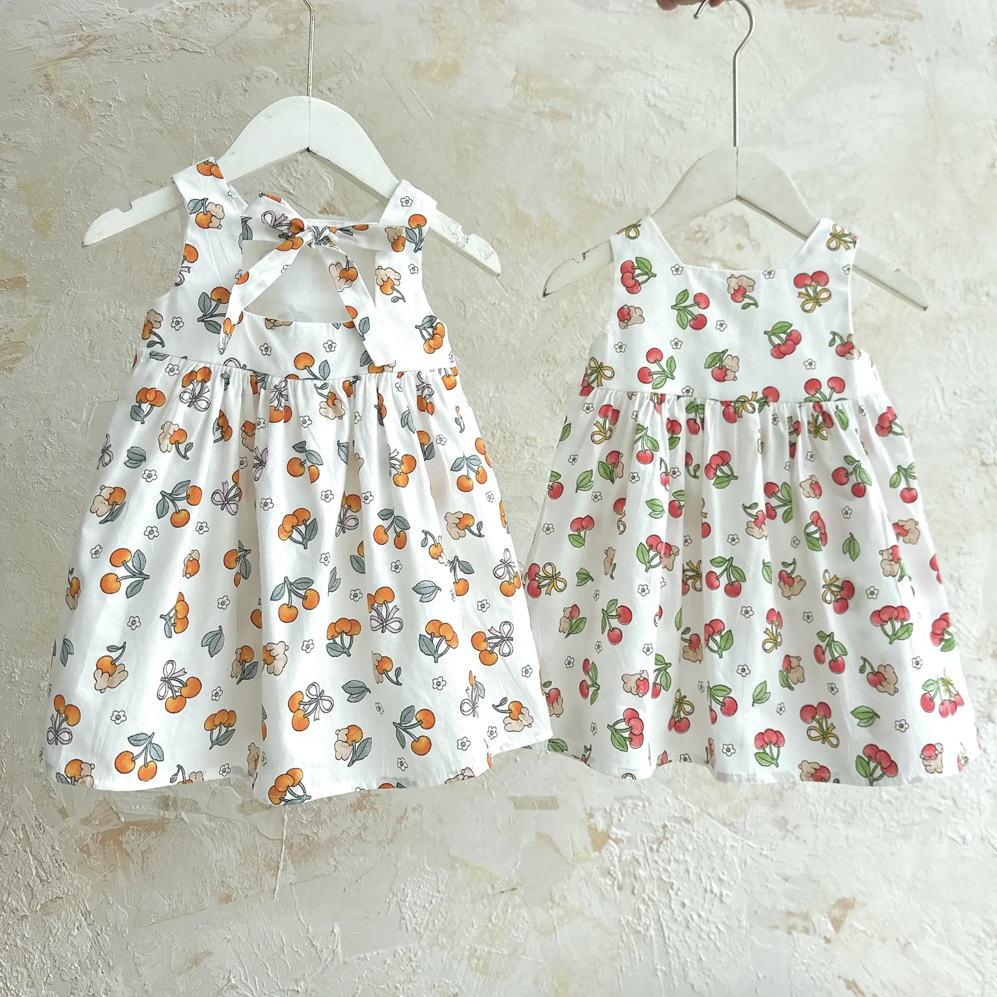 [Thỏ Tây Kids ] VÁY SÁT NÁCH NƠ LƯNG QUẢ CHERY _ T24