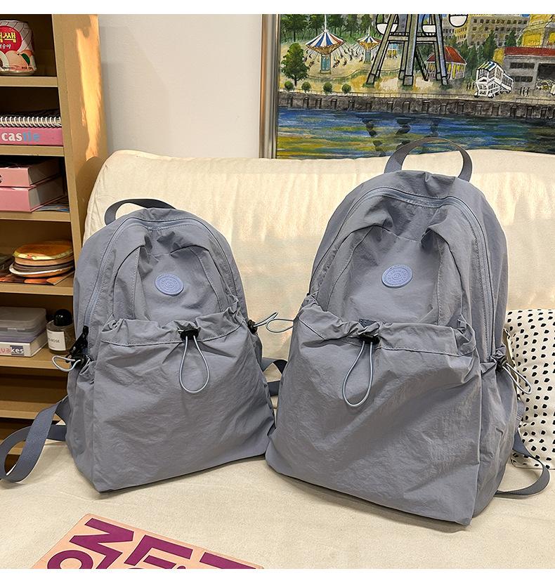 Product Introduction of Backpack, Student Schoolbag, Outdoor Backpack Leisure Simple and Lightweight Early High School Student Schoolbag New Drawstring All-Match Travel Backpack 15