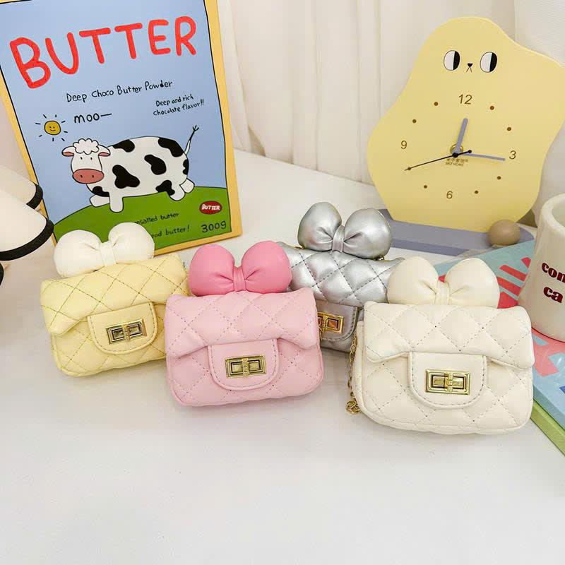 Túi đeo chéo sành điệu HÌNH NƠ xích vàng cho bé gái