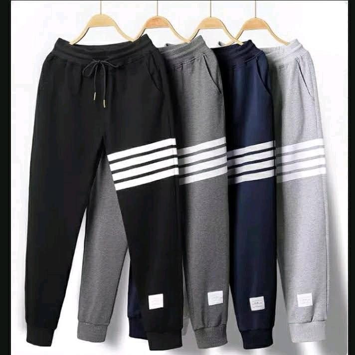Quần Thể Thao Nam Nữ Kẻ 4 Sọc Chất Nỉ Bông Mềm Mịn Quần Lưng Thun 2 Bên Có Túi Có 3 Màu Đen , Xám và Xanh Đen Unisex