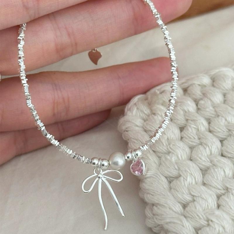 Lắc tay nơ bạc S925 tim hồng ngọc đá vỡ nhẹ nhàng AT Jewelry vòng tay nữ