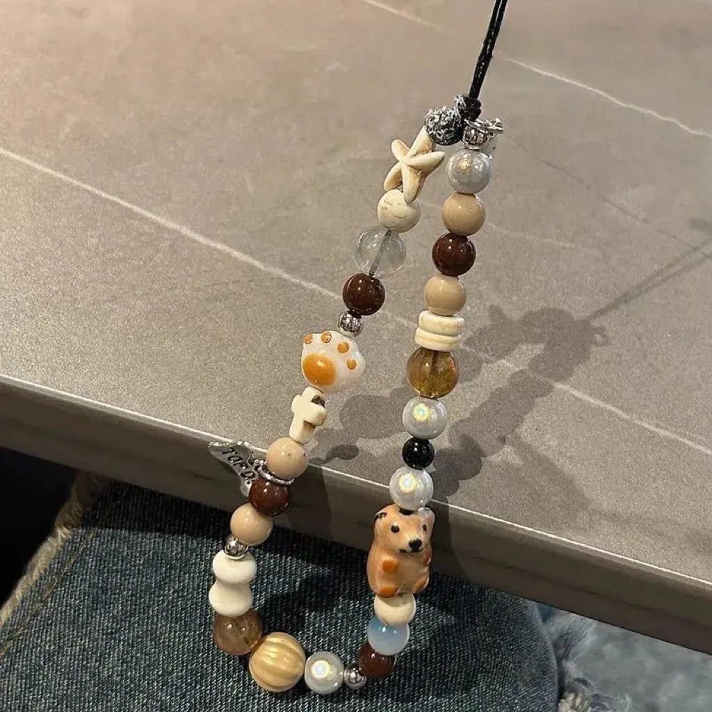 Ins wind bone dog bead pendant mobile phone shell universal ccd lanyard short chain decoration cold wind portable anti-lost jewelry mobile phone chain.phone charm hippers capybara kazehaya camera phone charm