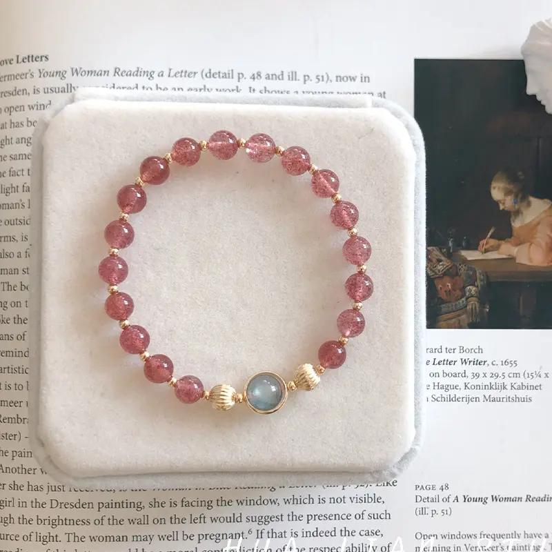 A natural strawberry quartz bracelet and moonstone jewelry.