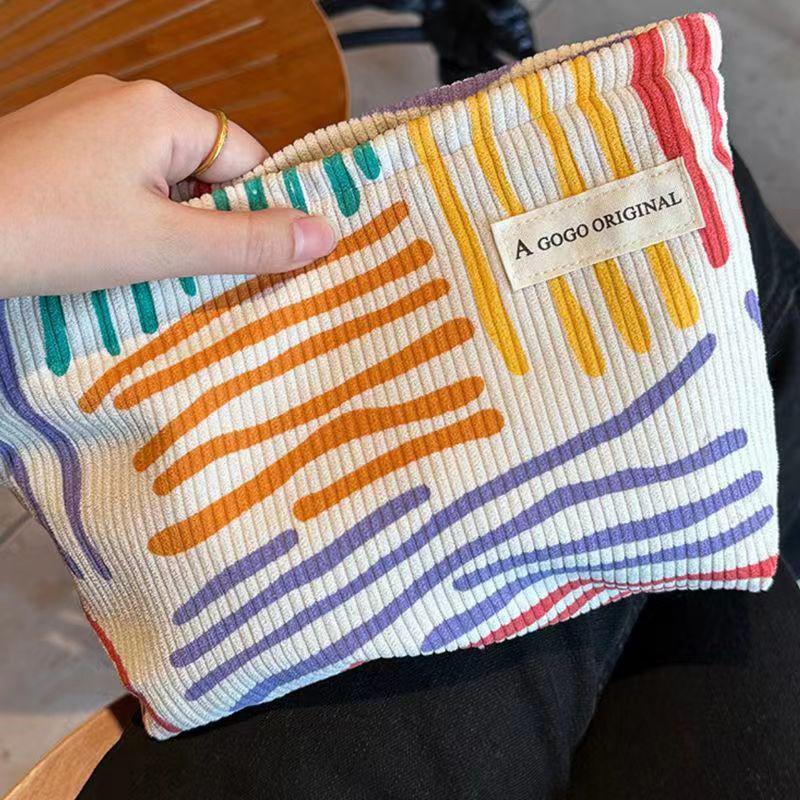 Product Introduction of Korduroi cosmetic bag with colorful stripes, portable travel toiletry bag, skin care, various items, aesthetic makeup storage bag 15
