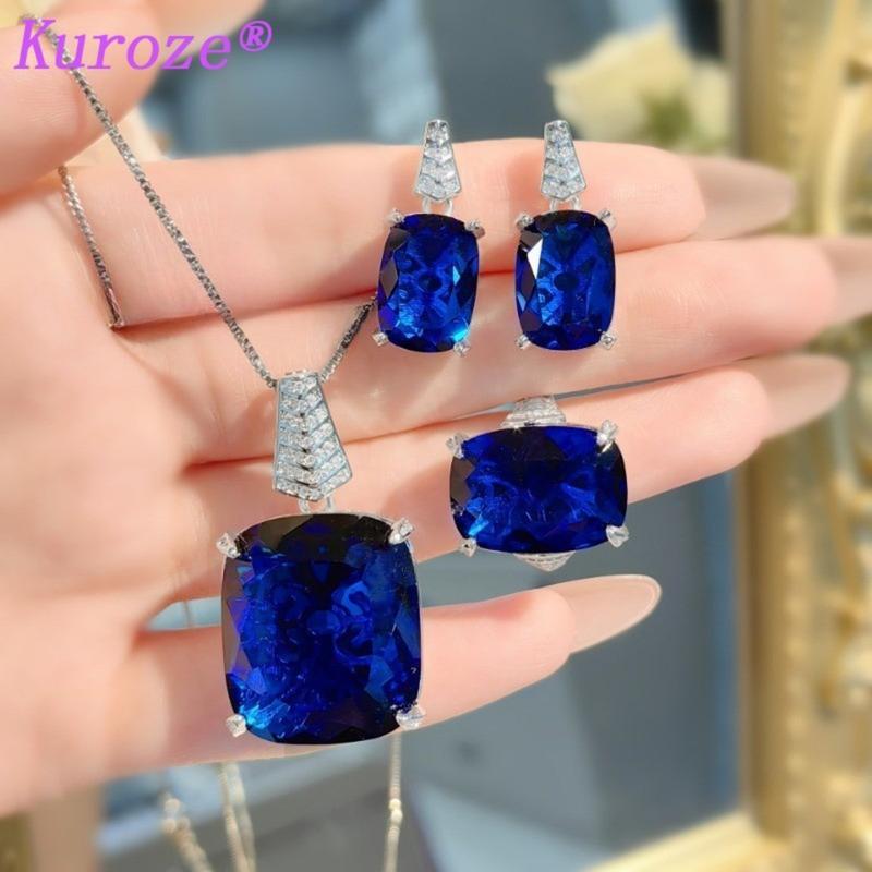 Product Introduction of Kuroze new royal blue pigeon blood red pendant large carat fat square colored treasure earrings Paraiba ring green diamond suit women 19