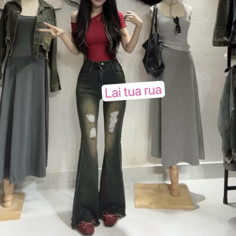 Quần loe dài rách đùi màu xanh jeans đậm bụi co dãn hack dáng lai tua