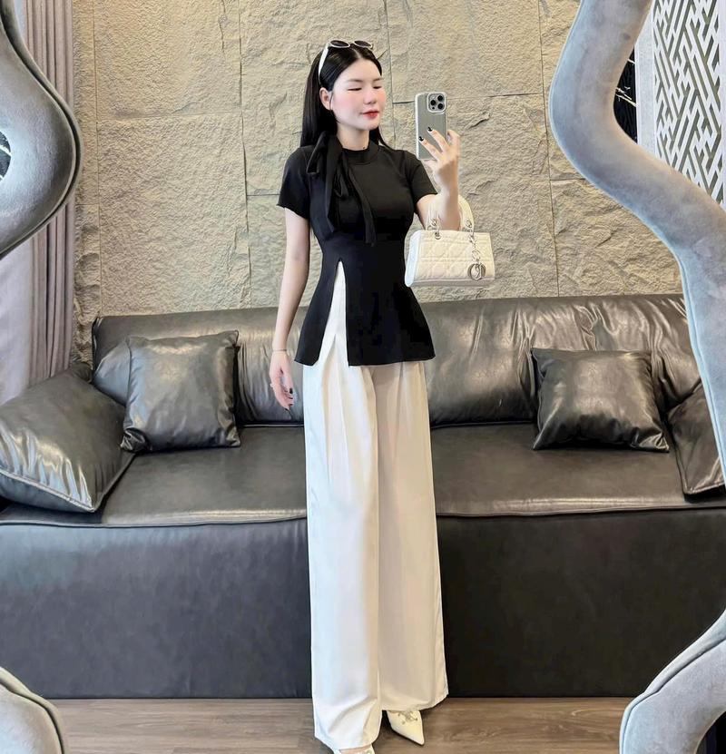 Product Introduction of Set đồ nữ áo tay ngắn cổ tròn buộc nơ xẻ tà mix quần xuông ống rộng dánh dài xinh xắn dành cho các nàng diện đi chơi đi tiệc. Nhung Ong Women Voi 12