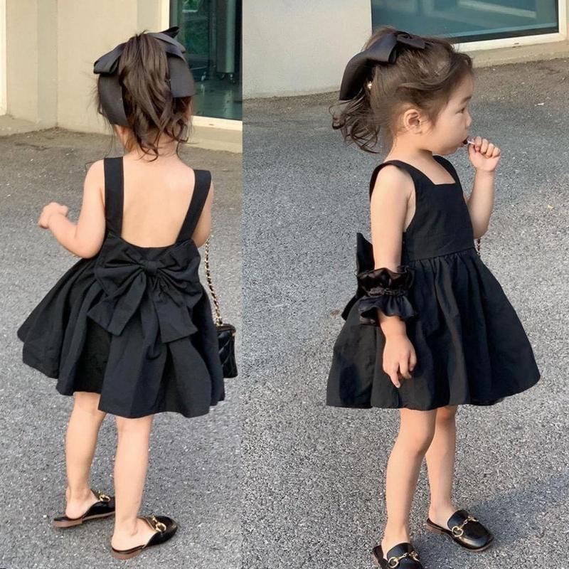 Váy Đen Hở Lưng Đính Nơ Tặng Kèm Buộc Tóc Siêu Xinh Cho Bé Gái 8-28kg