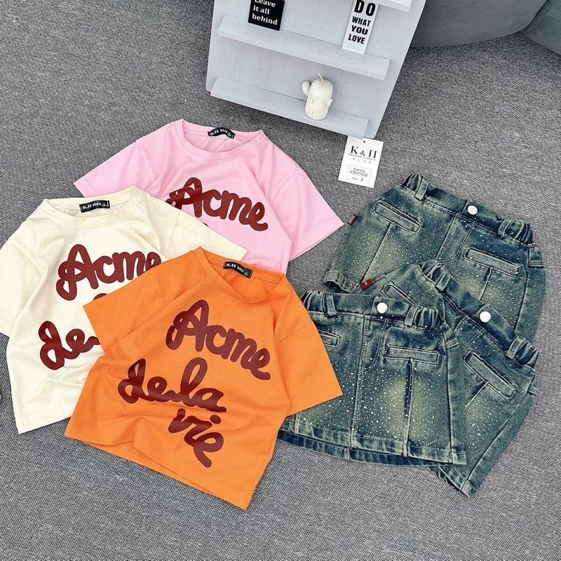  Áo cotton chữ mềm mát +Chân Váy Jean đính đá sành điệu có quần bé gái 9-32kg  3 mầu Cam ,Be Hồng  
