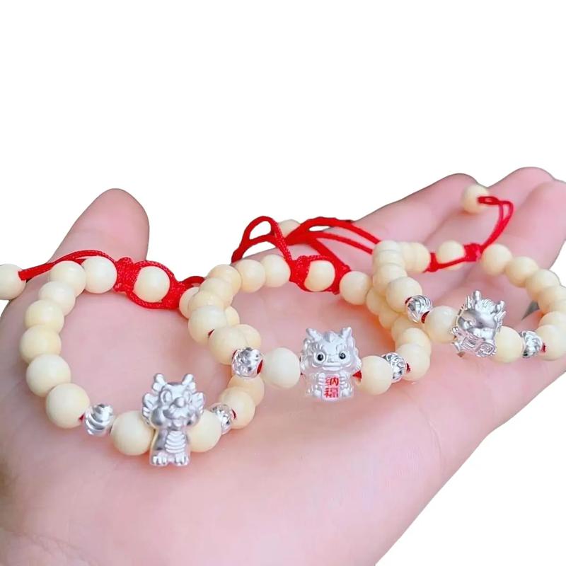 Vòng dâu tằm mix charm rồng & bi bạc cho bé yêu