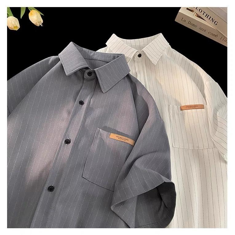 (COD)Áo sơ mi cộc tay nam nữ kẻ sọc nhẹ, 2 màu ghi trắng hottrend có logo ở túi trước, designed by Nice Clothes