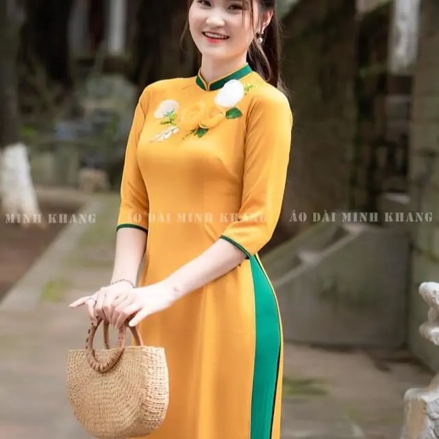 Áo Dài vàng thêu đính phối cổ xanh chất lụa Mỹ