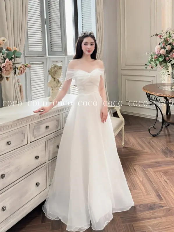 Váy Cưới Đi Bàn Trễ Vai  Kèm Nơ Kem Voi