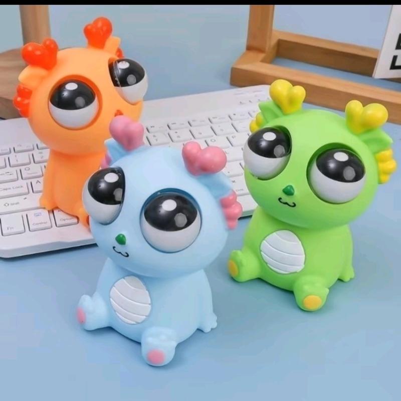 Đồ chơi rồng mắt lồi Squishy bóp xả Stress.Với ba màu sắc: màu Cam Xanh Lá Xanh Dương.