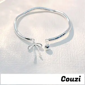 [Couzi]Gelang wanita perak berbentuk pita dengan garis lonceng melengkung dan desain terbuka B942