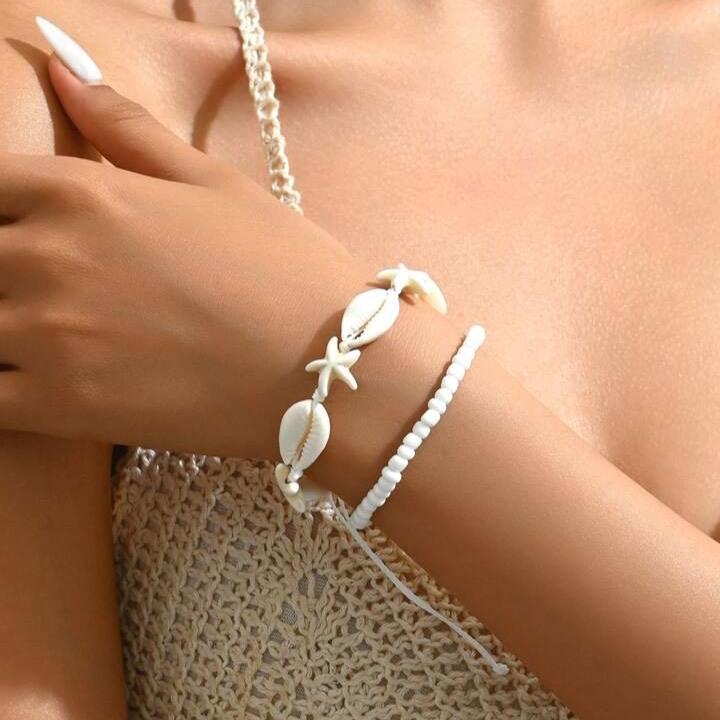 Set 2 vòng tay đi biển mix sao vỏ ốc thật 0