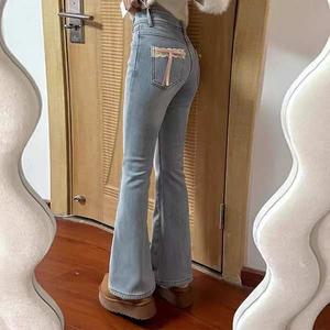 กางเกงยีนส์ไมโคร สีอ่อน สำหรับผู้หญิง เปิดตัวต้นฤดูใบไม้ผลิ 2025 ดีไซน์โบว์ เอวสูง กระชับสัดส่วน กางเกงขาบานเกือกม้า ฟอง