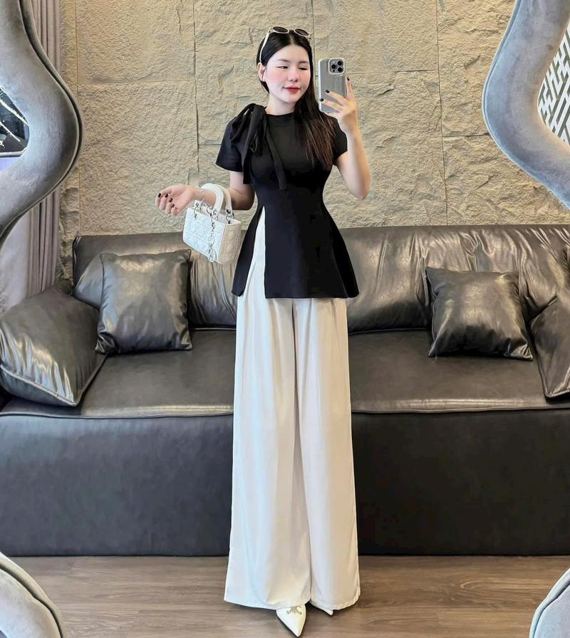 Product Introduction of Set đồ nữ áo tay ngắn cổ tròn buộc nơ xẻ tà mix quần xuông ống rộng dánh dài xinh xắn dành cho các nàng diện đi chơi đi tiệc. Nhung Ong Women Voi 15