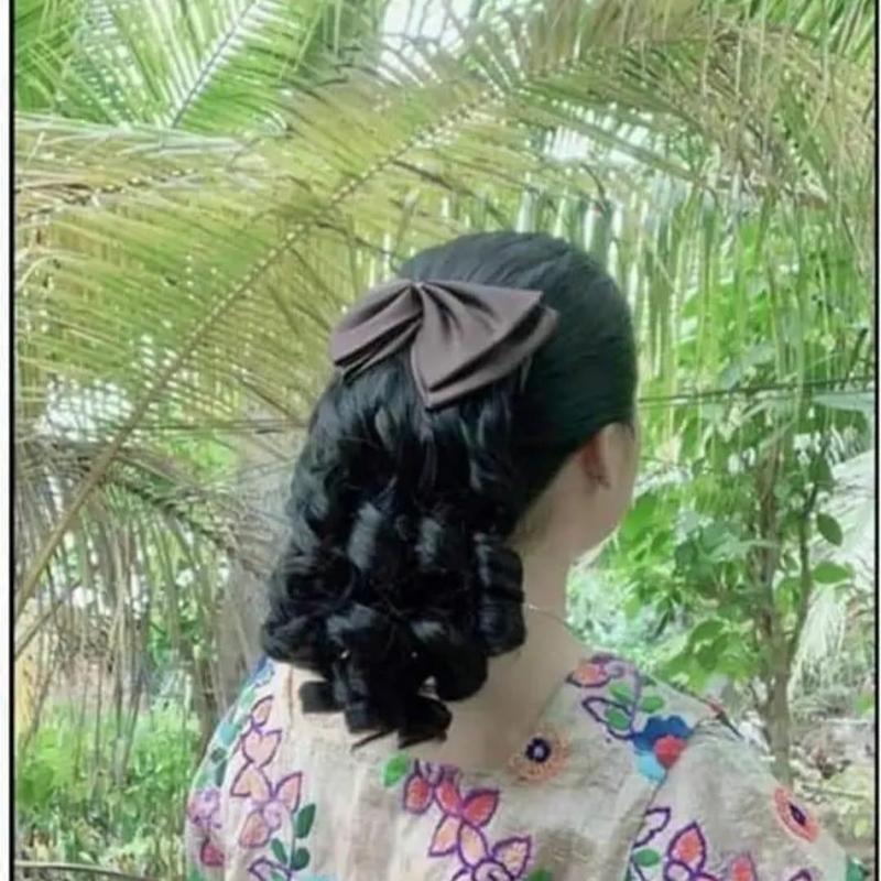tóc búi kẹp nơ trung niên xoăn lọn sang trọng